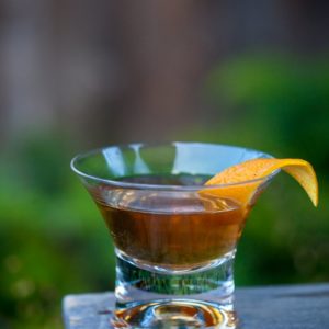 cocktail in viski manhattan glass with orange garnish